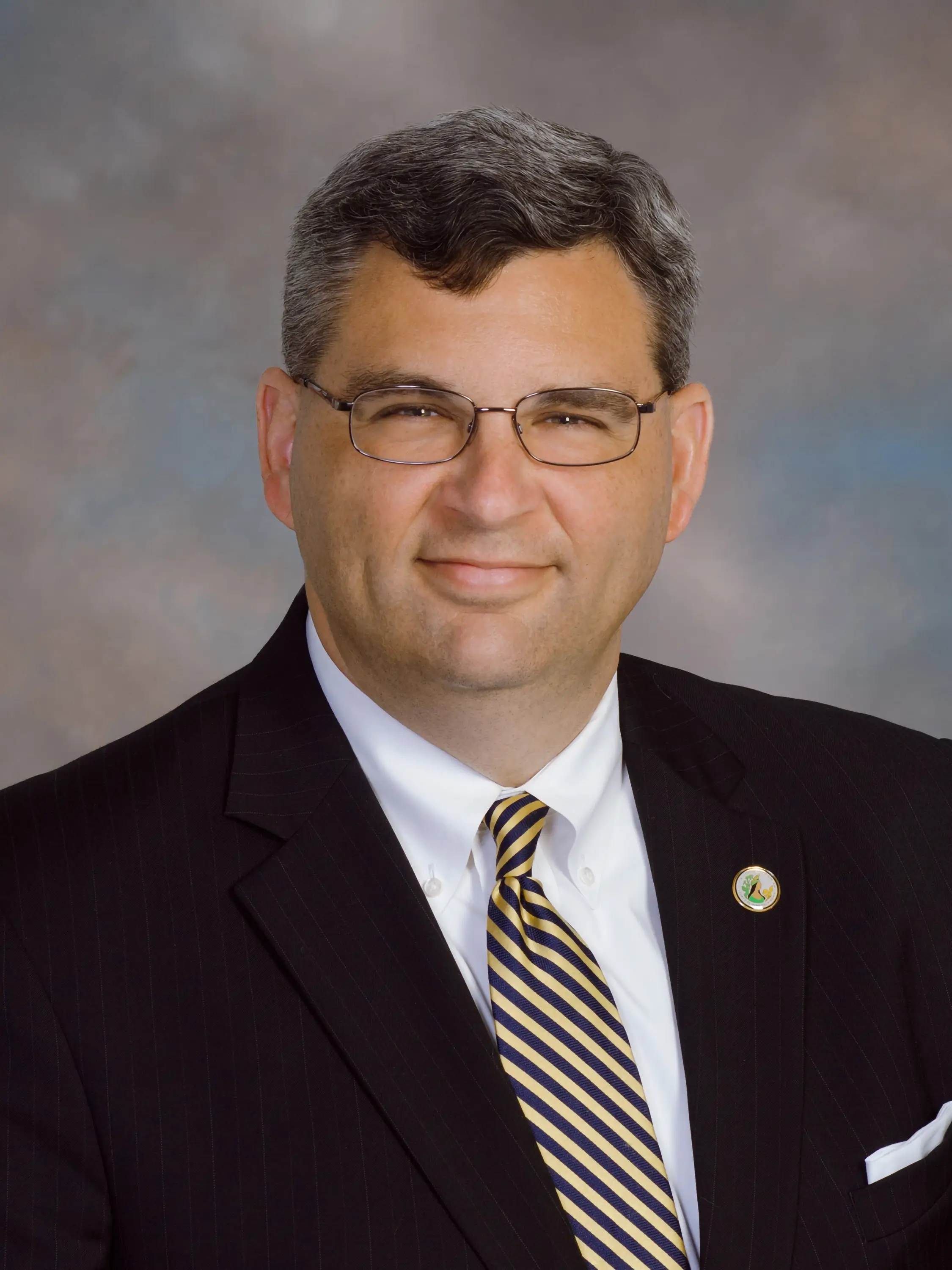 A headshot of Anthony J. Romanello