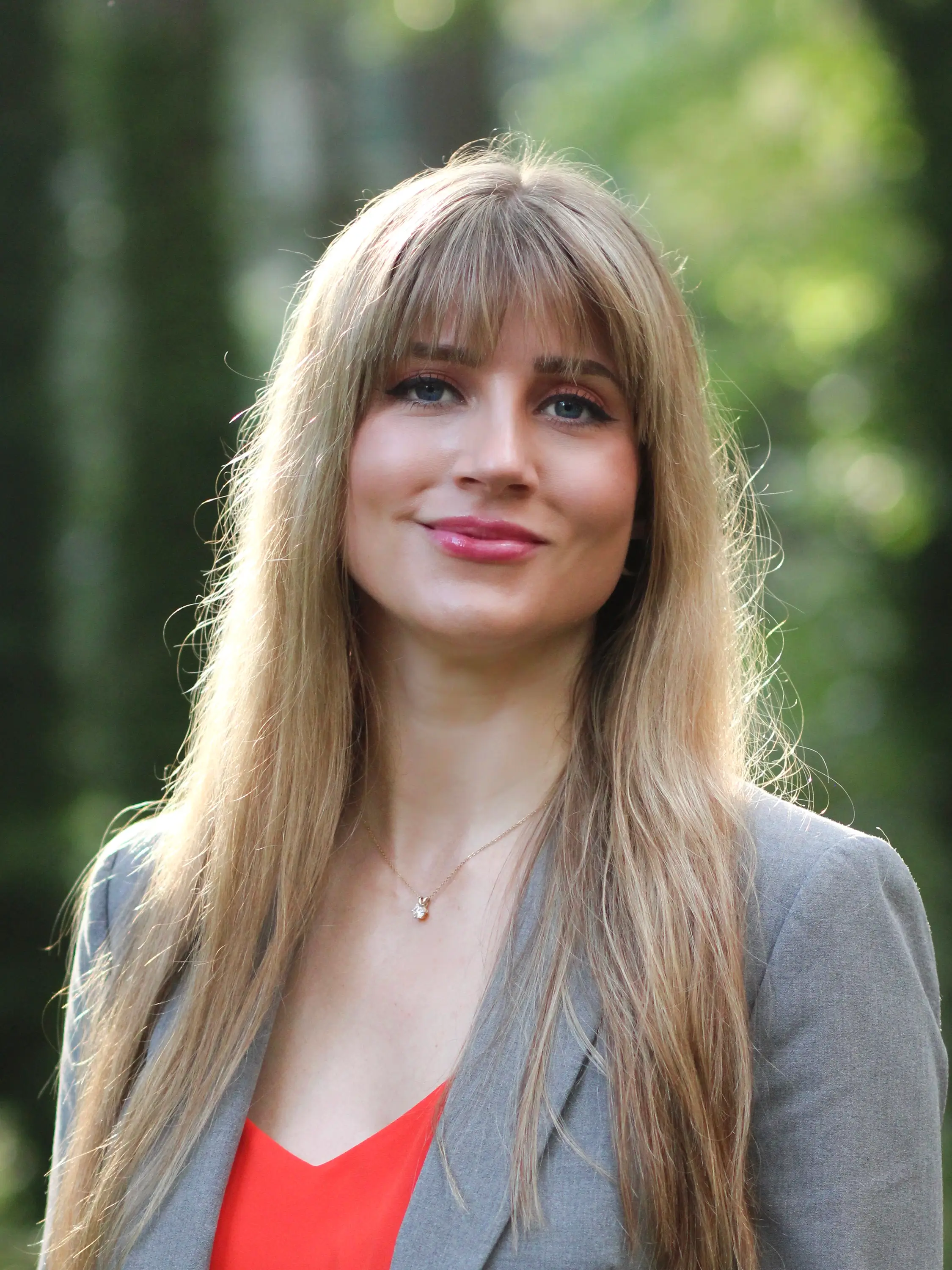 A headshot of Ashley Kubat