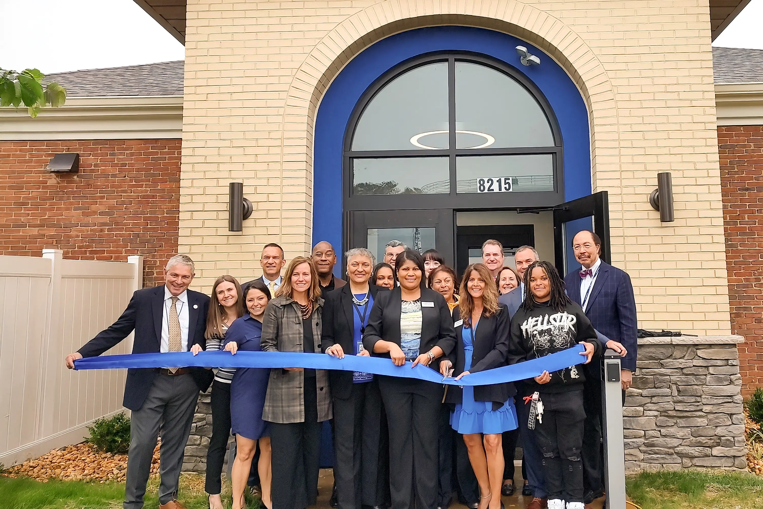 A ribbon cutting with the staff in front of Fulton Bank