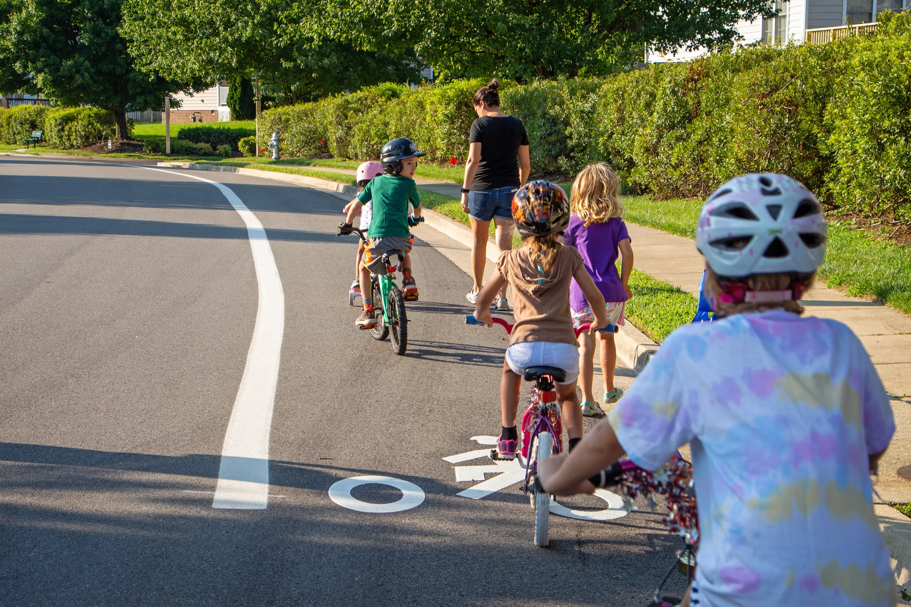 Kids riding in the bike lane