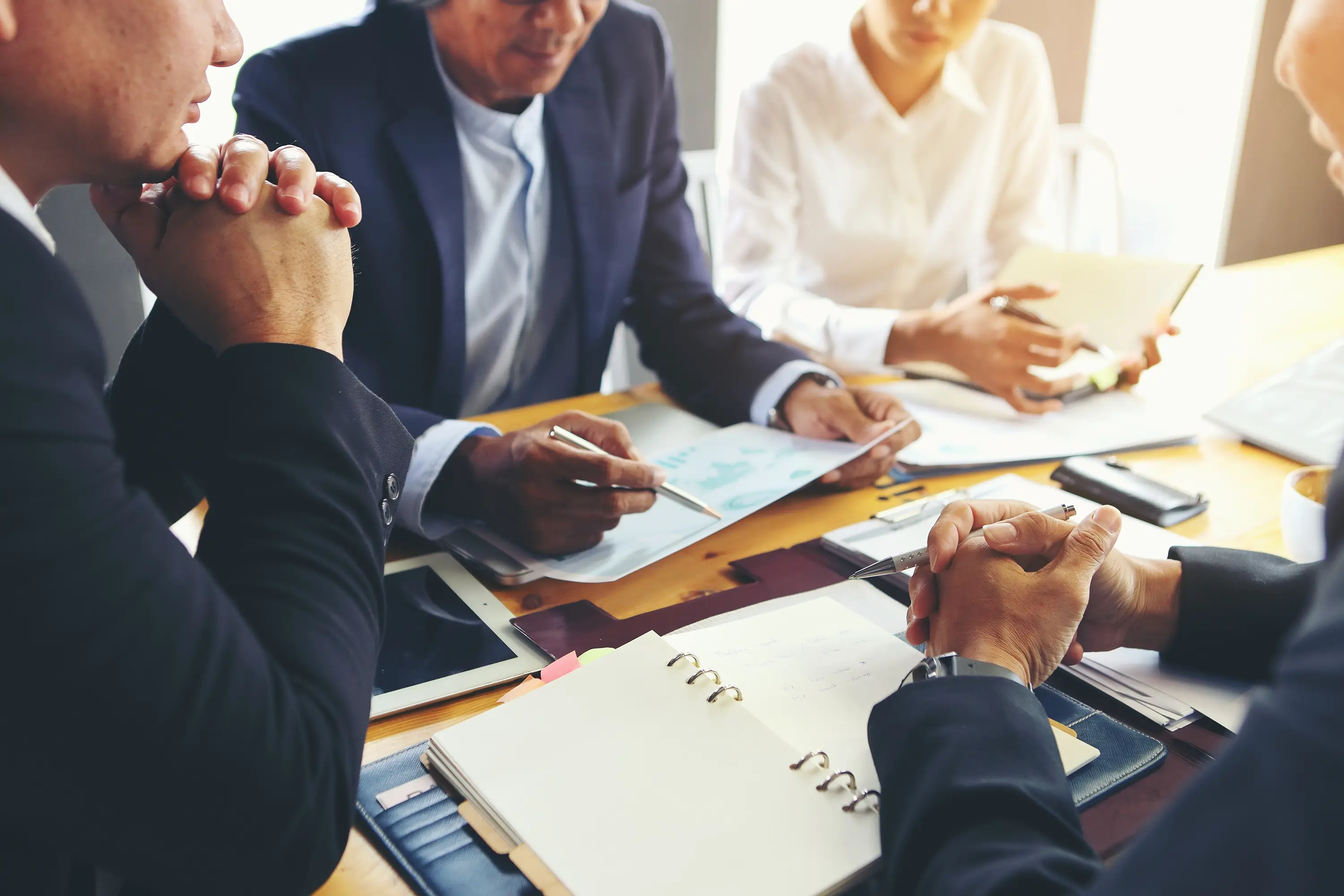 A stock photo of businessmen sitting at a table