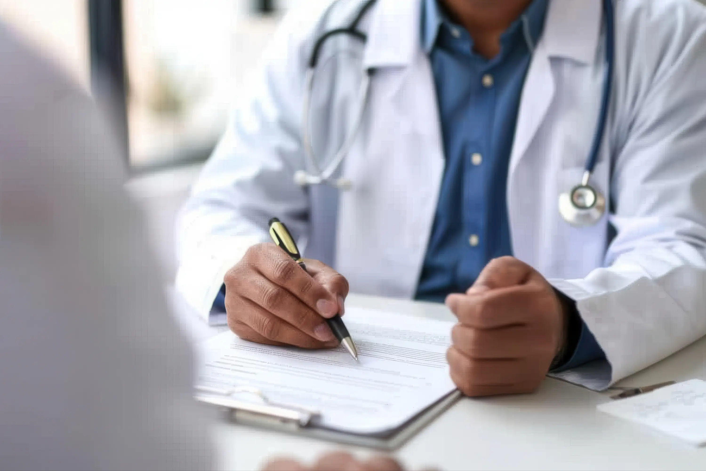 A stock photo of a doctor with a pen