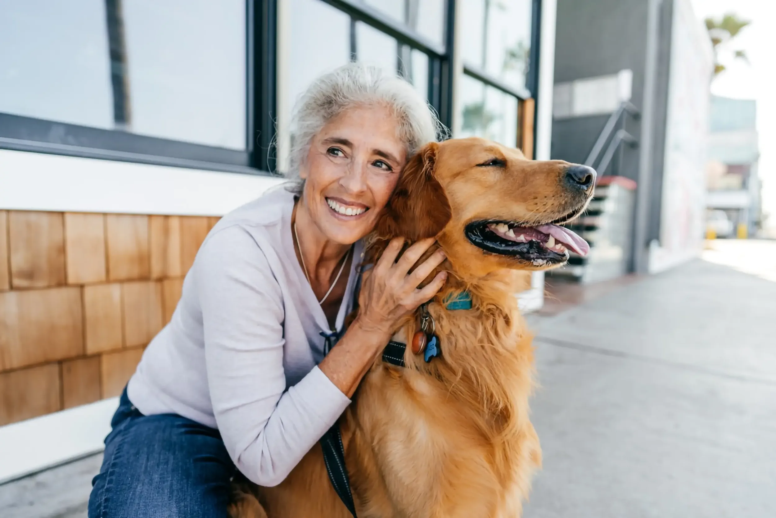An elderly lady with her dog