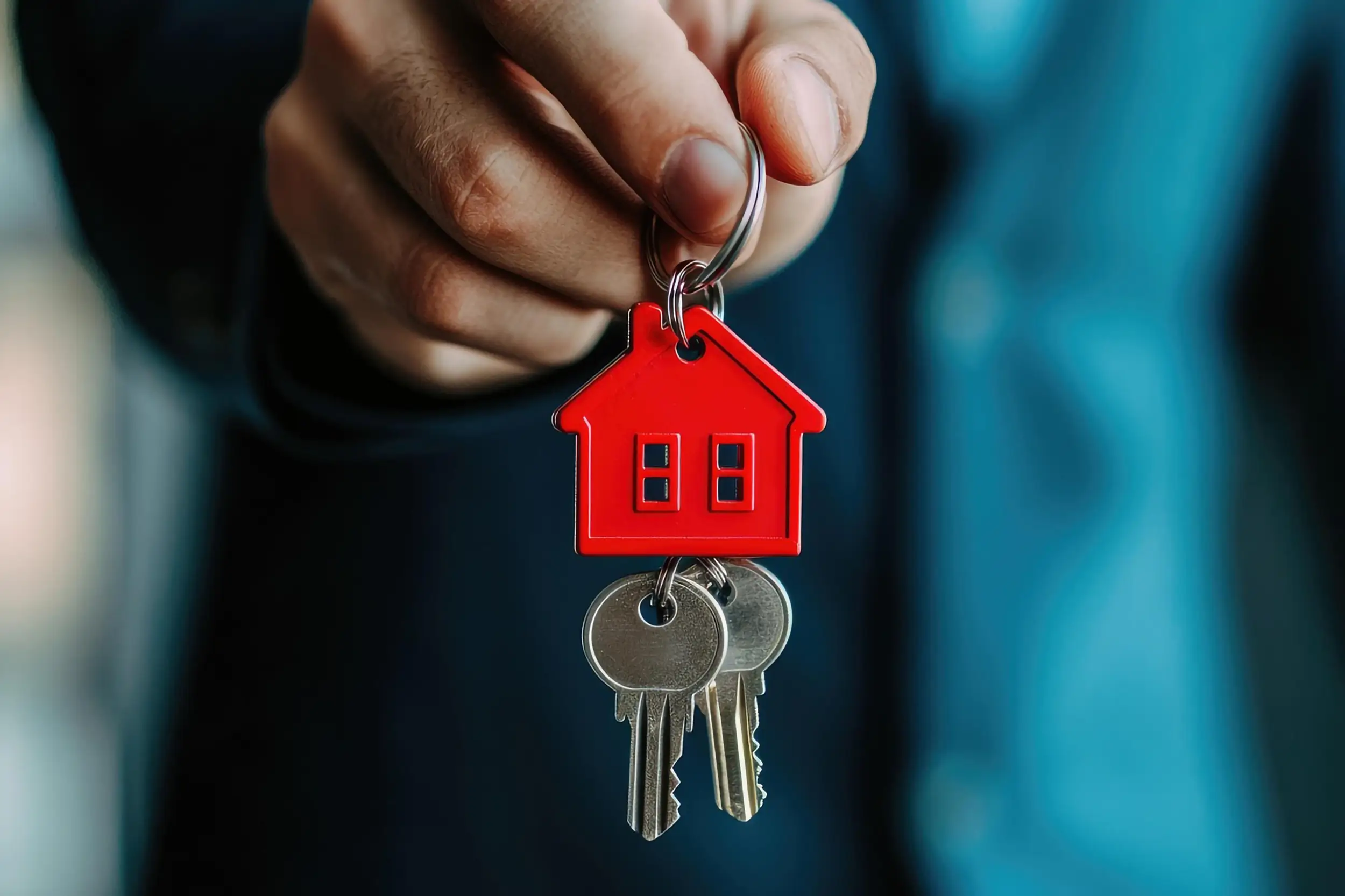A stock ai image of keys hanging from a home shaped keyring