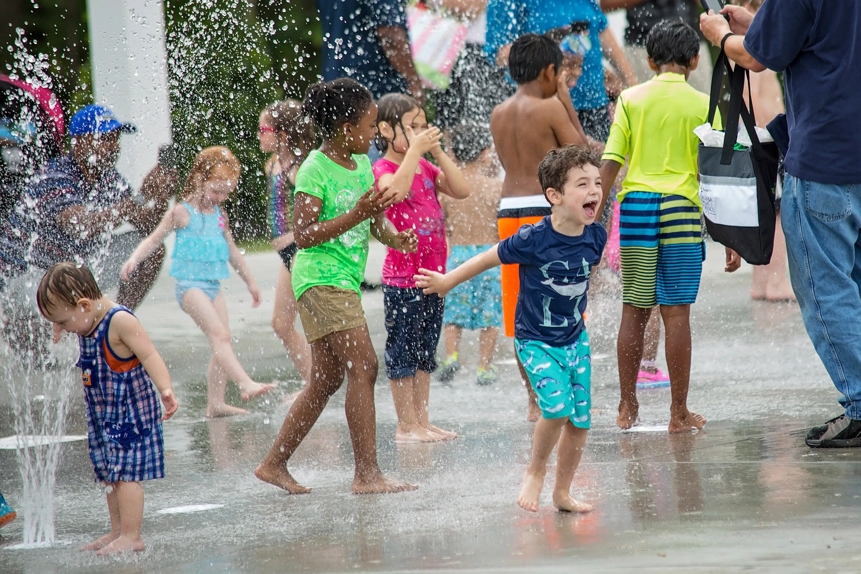 Kids at a park playing in water