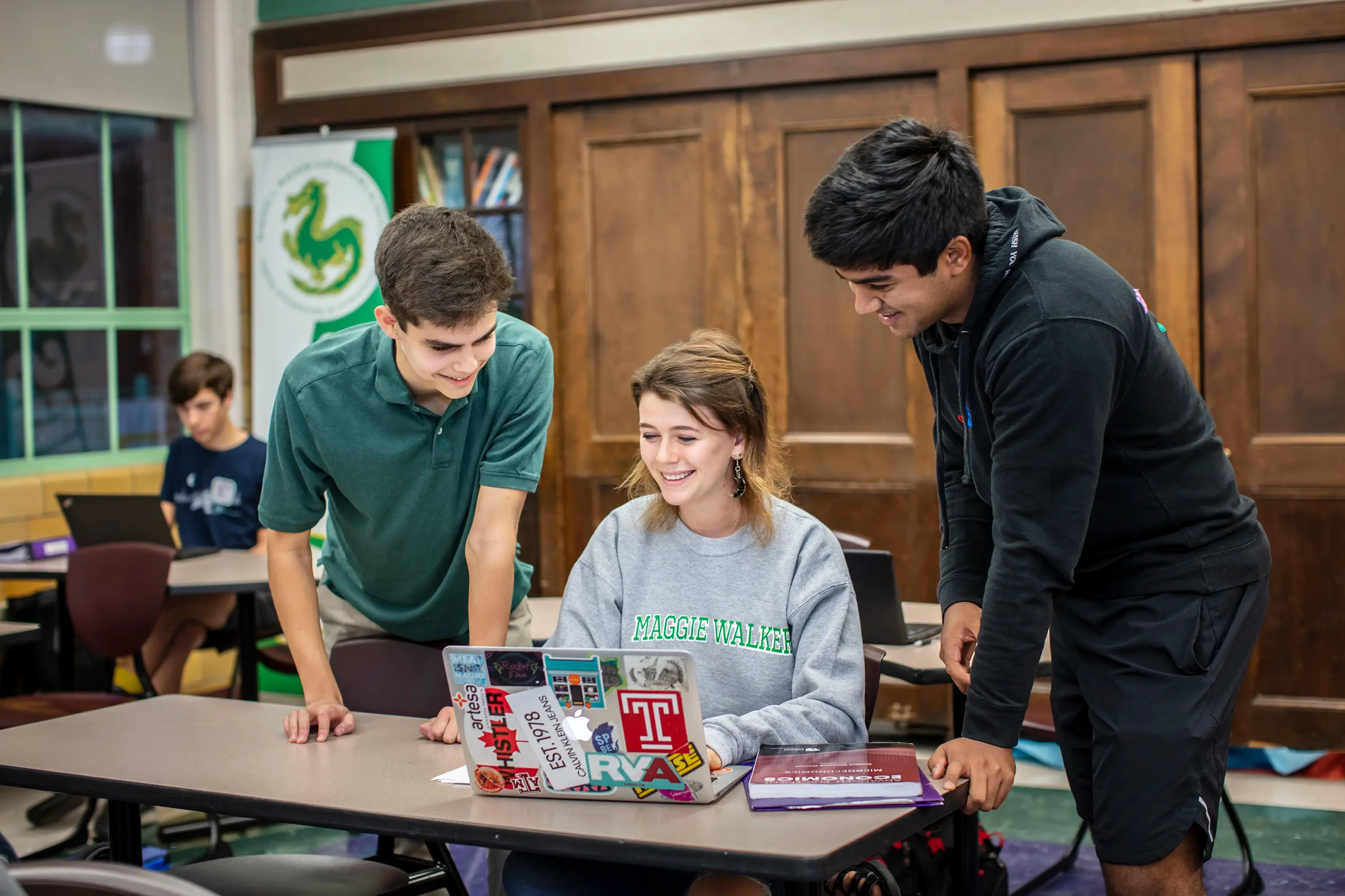 Students looking at a computer at Maggie L Walker Governor's School