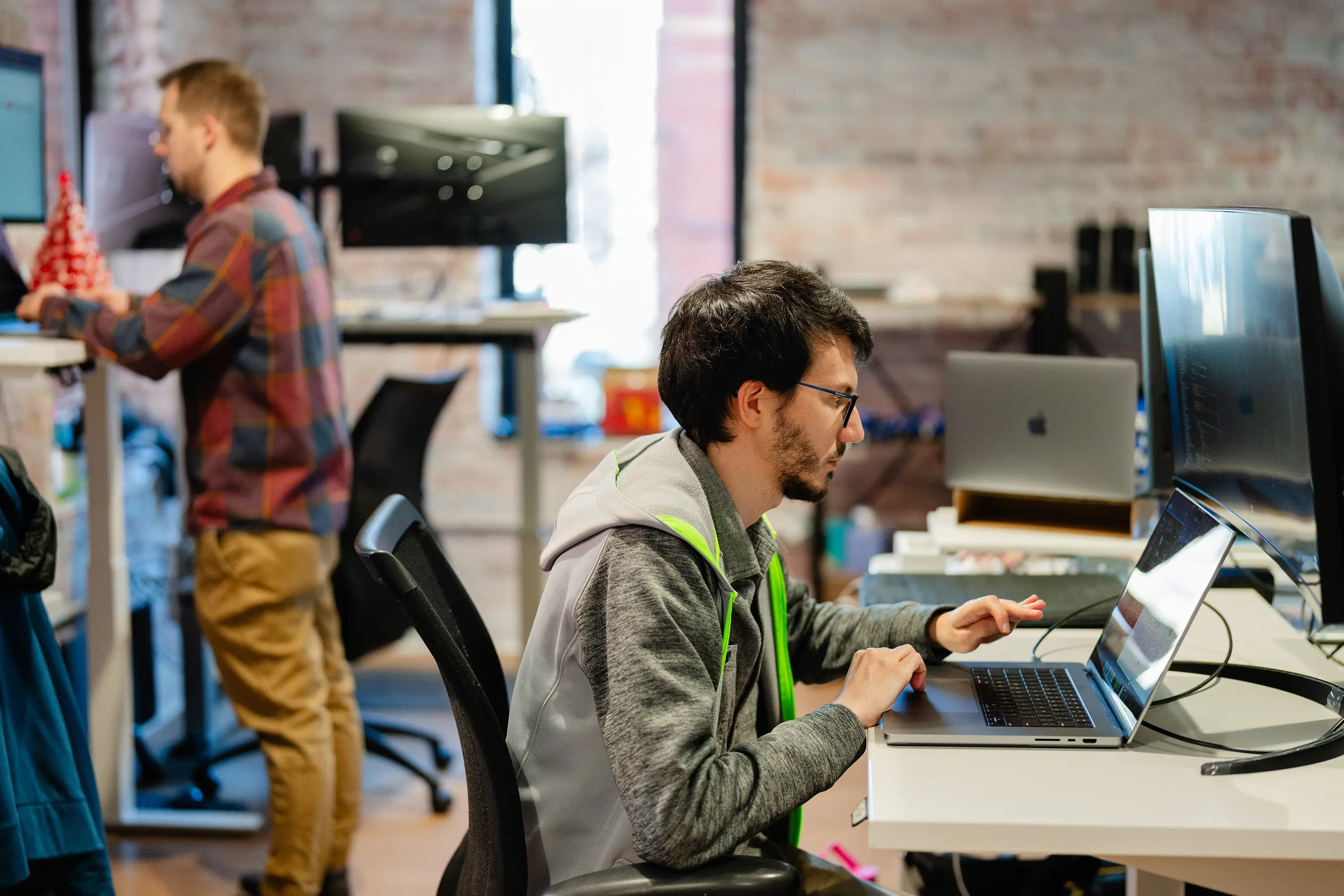 A man in the Start-Up VA program working on a laptop