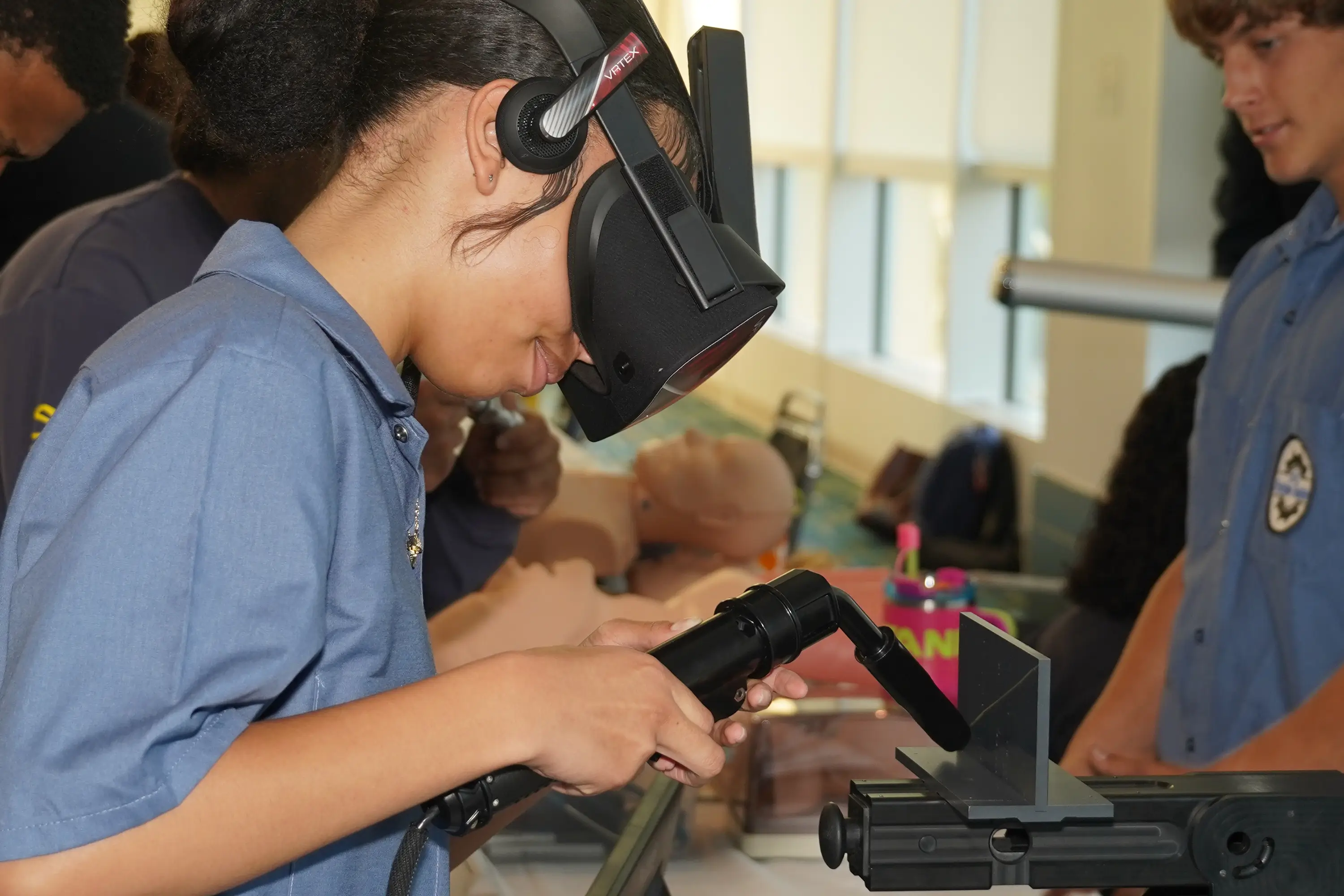 A girl holding a torch welding